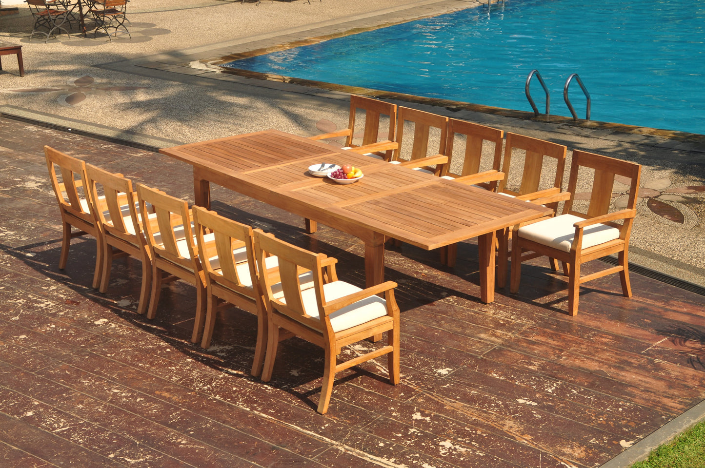 122" Caranas Dining Table with Osborne Arm Chairs teak outdoor furniture photo
