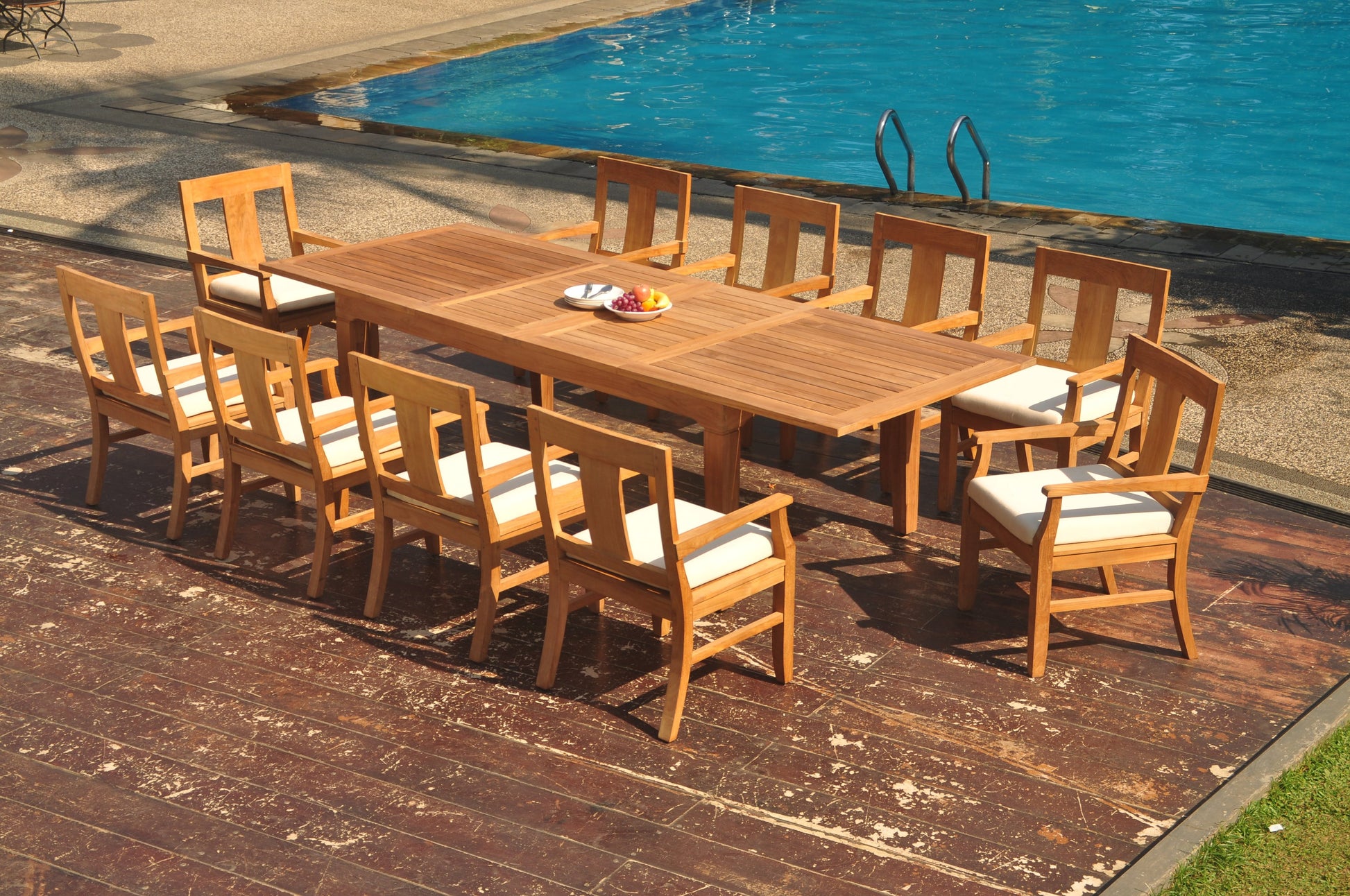122" Caranas Dining Table with Osborne Arm Chairs teak outdoor furniture photo