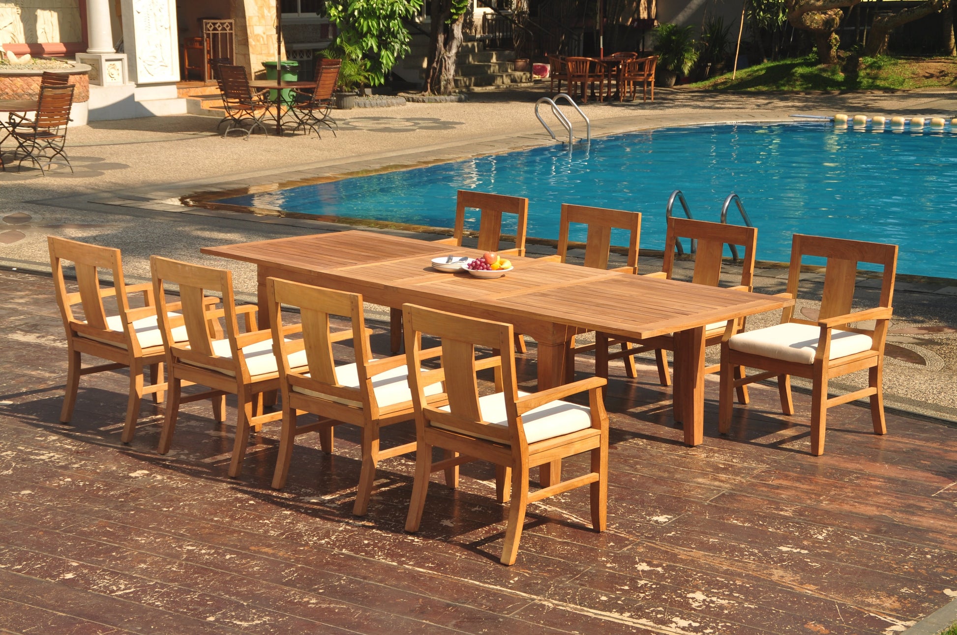 122" Caranas Dining Table with Osborne Arm Chairs teak outdoor furniture photo