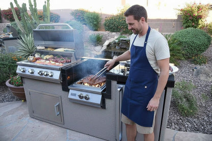 Luxterra Outdoor Living KoKoMo BBQ Island with stainless steel grill, wok burner, and refrigerator in a backyard.