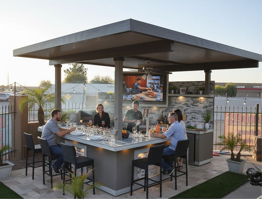 Luxterra Outdoor Living KoKoMo Bermuda BBQ island with built-in TV, fire pit, and bar seating for outdoor entertaining.